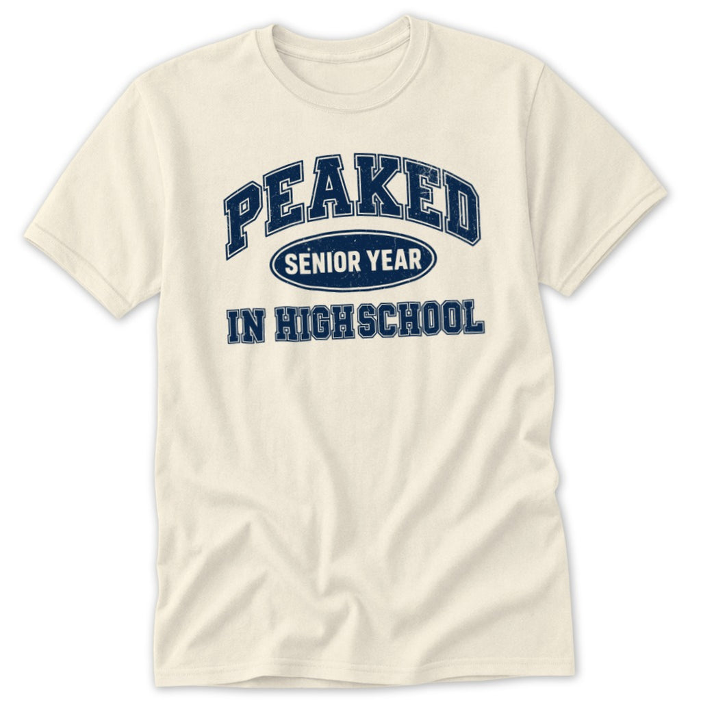 Cream t-shirt with navy text reading "PEAKED SENIOR YEAR IN HIGH SCHOOL".