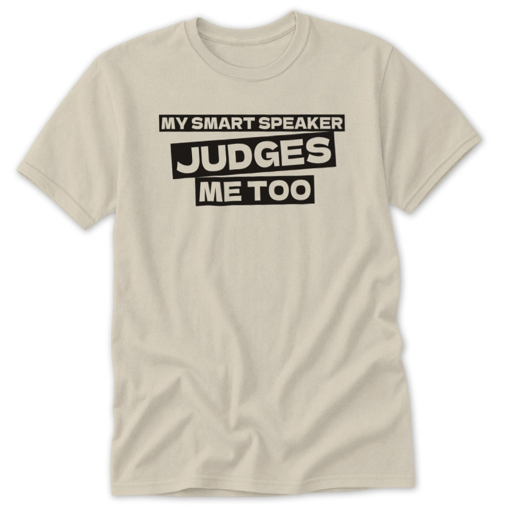 Cream t-shirt with black text that reads "MY SMART SPEAKER JUDGES ME TOO".