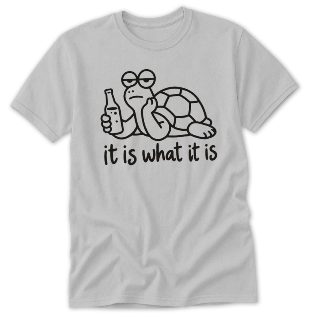 Light gray t-shirt featuring a cartoon turtle holding a bottle, with the text "it is what it is."