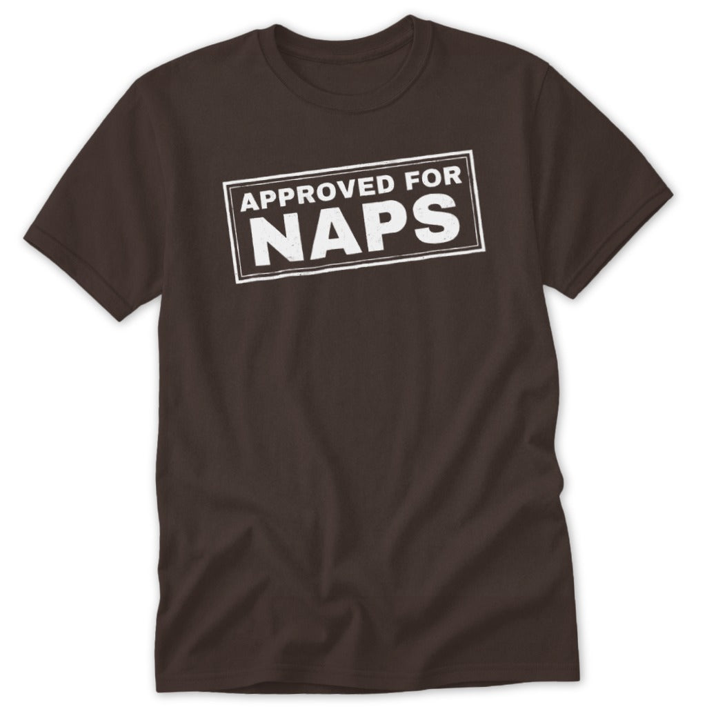 A brown crewneck t-shirt featuring a white rectangular stamp graphic with the text APPROVED FOR NAPS.