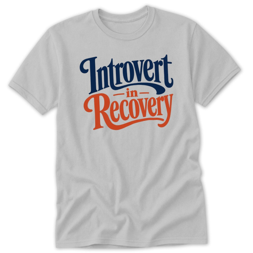 A light grey t-shirt featuring the blue and orange text Introvert in Recovery.