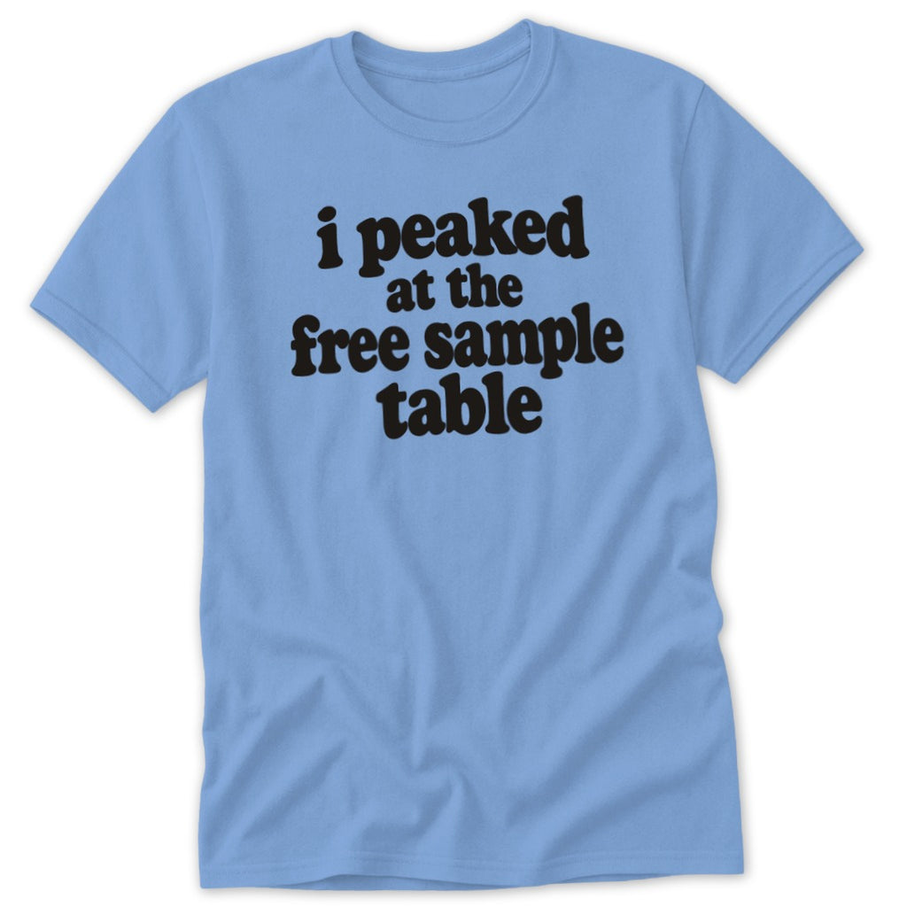 A light blue crewneck t-shirt with black text that reads, i peaked at the free sample table.