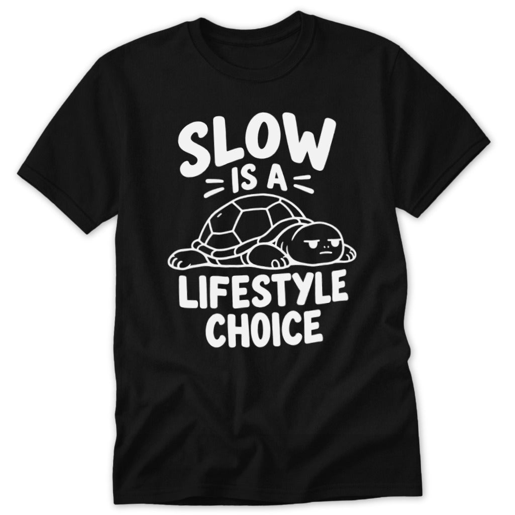 A black t-shirt printed with a white graphic of a turtle and the text "SLOW IS A LIFESTYLE CHOICE".