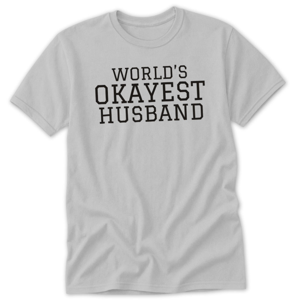 Light grey t-shirt with black text reading "WORLD'S OKAYEST HUSBAND".