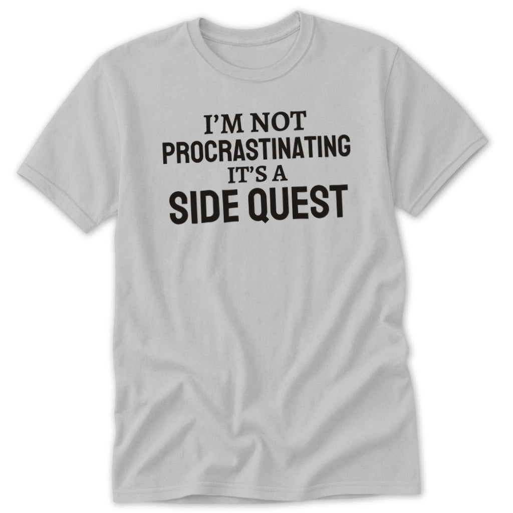 Light grey t-shirt with black text reading "I'M NOT PROCRASTINATING IT'S A SIDE QUEST".