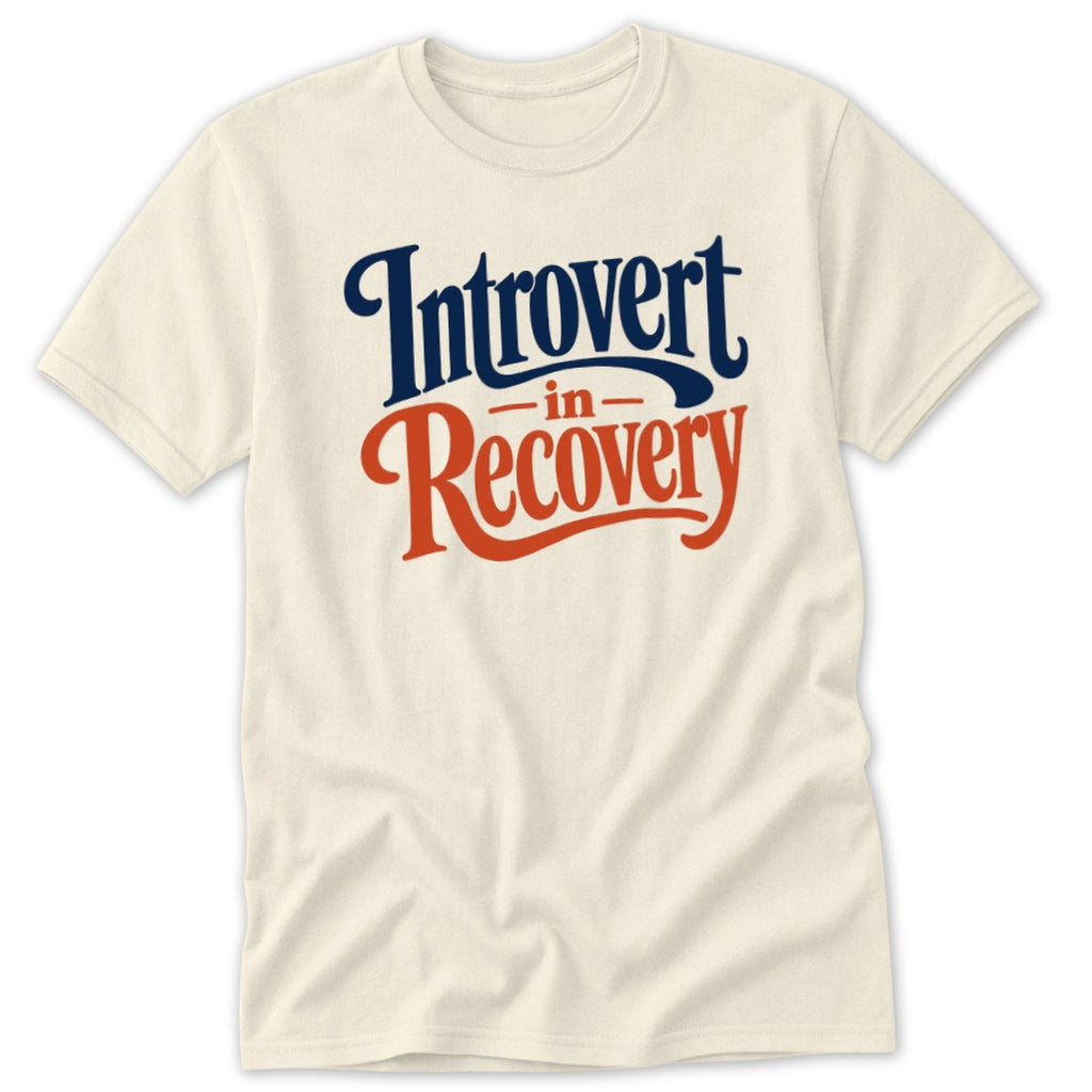 Cream-colored crewneck t-shirt featuring blue and orange text reading Introvert in Recovery.