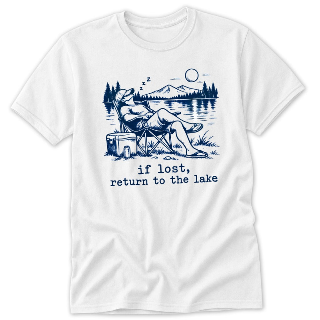 White t-shirt with illustration of man sleeping in chair by lake, text "if lost, return to the lake".