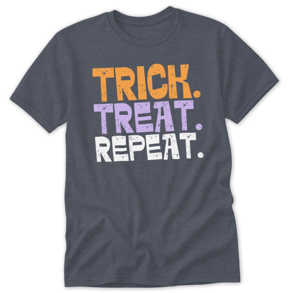 Dark gray t-shirt with orange, purple, and white text that says "TRICK. TREAT. REPEAT."