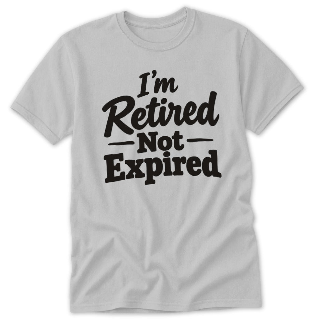A light gray crewneck t-shirt featuring black text that reads, I'm Retired Not Expired.