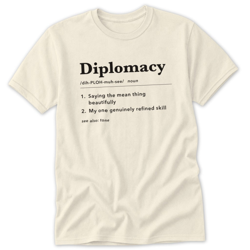 Cream t-shirt with "Diplomacy" definition printed in black text.