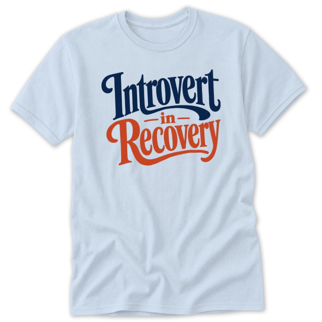 Light blue short-sleeved t-shirt featuring dark blue text that reads Introvert in Recovery with the word in in red.
