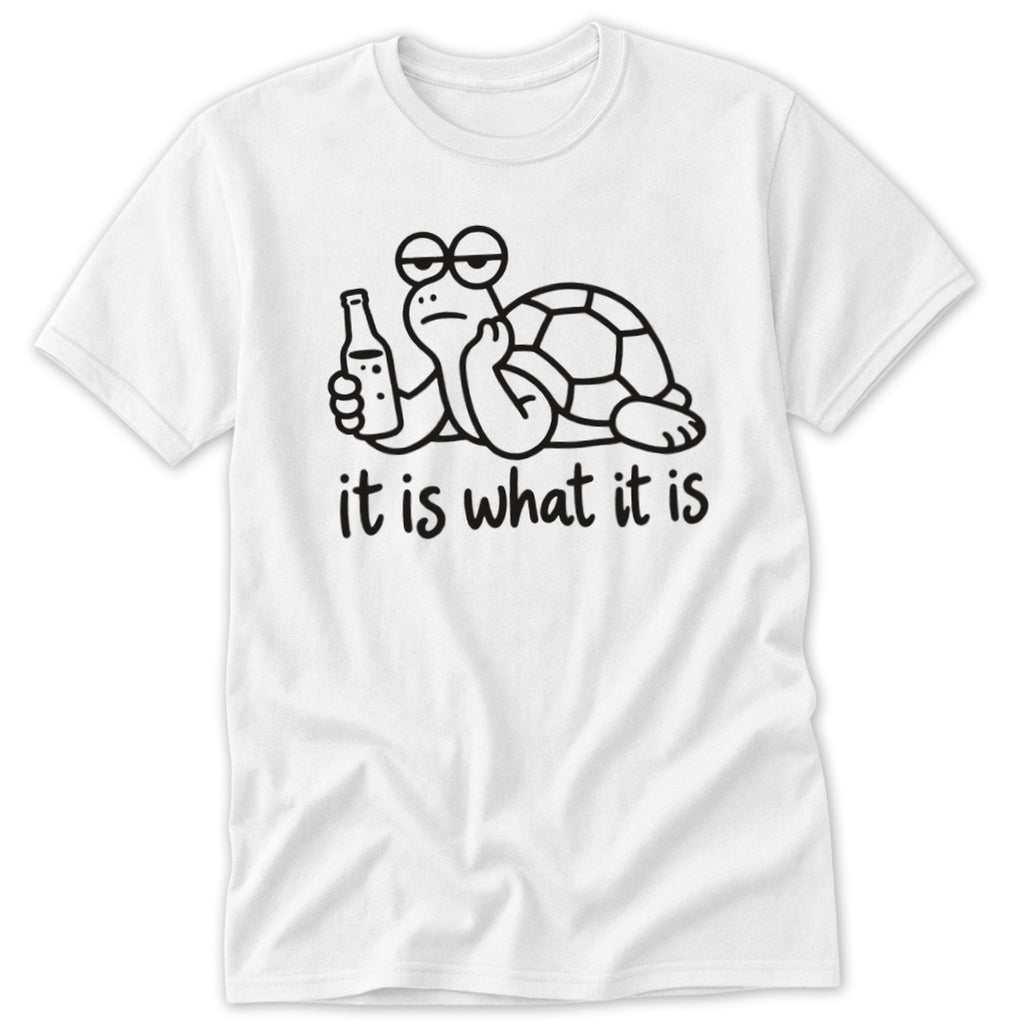 A white t-shirt featuring a cartoon turtle holding a bottle, with the text it is what it is below.