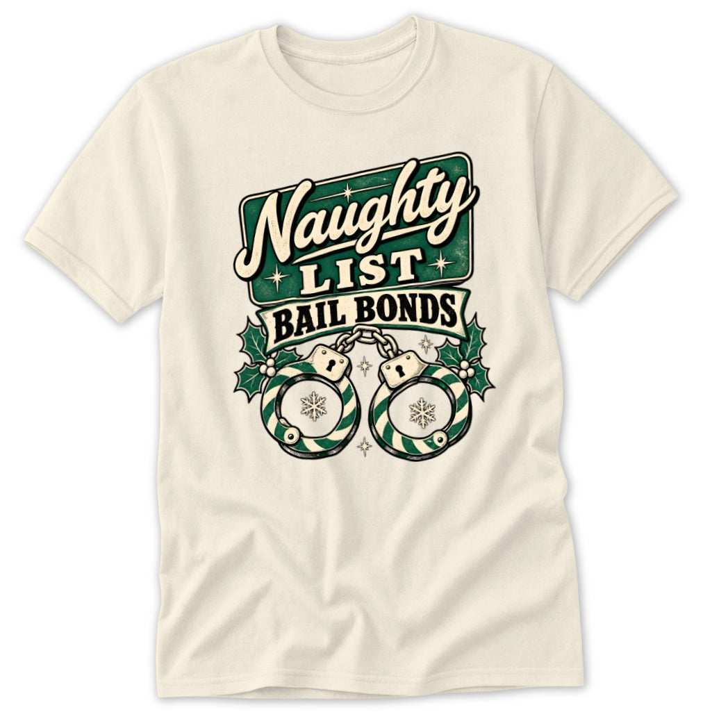 Cream t-shirt with a "Naughty List Bail Bonds" graphic featuring handcuffs and holly.