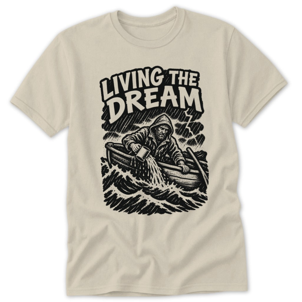 T-shirt with black graphic of man in stormy boat bailing water and text "LIVING THE DREAM."