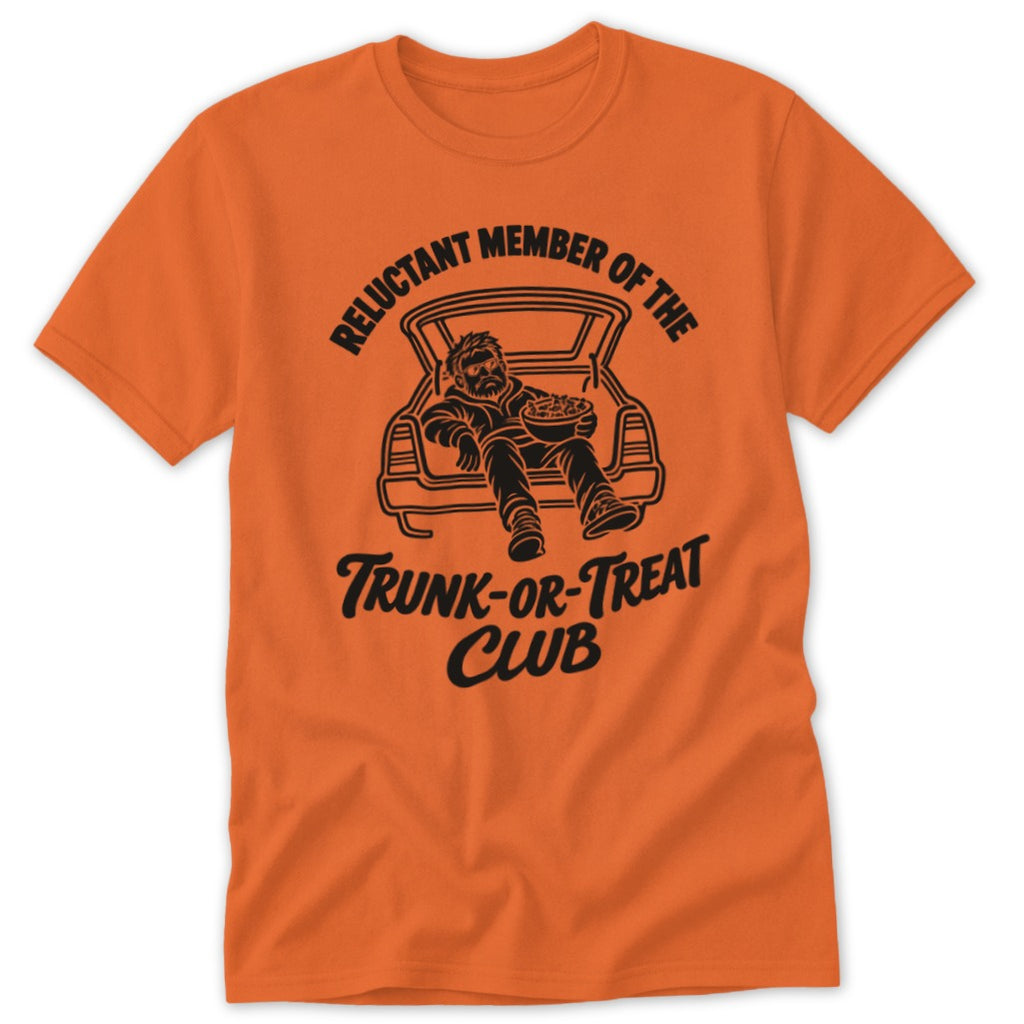 Orange t-shirt with black graphic of man in trunk holding bowl and text "Reluctant Member of the Trunk-or-Treat Club".