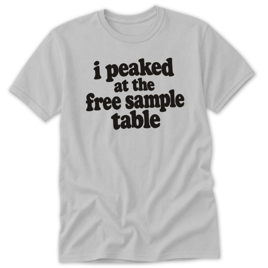 A light gray short-sleeved t-shirt featuring the black text "i peaked at the free sample table".