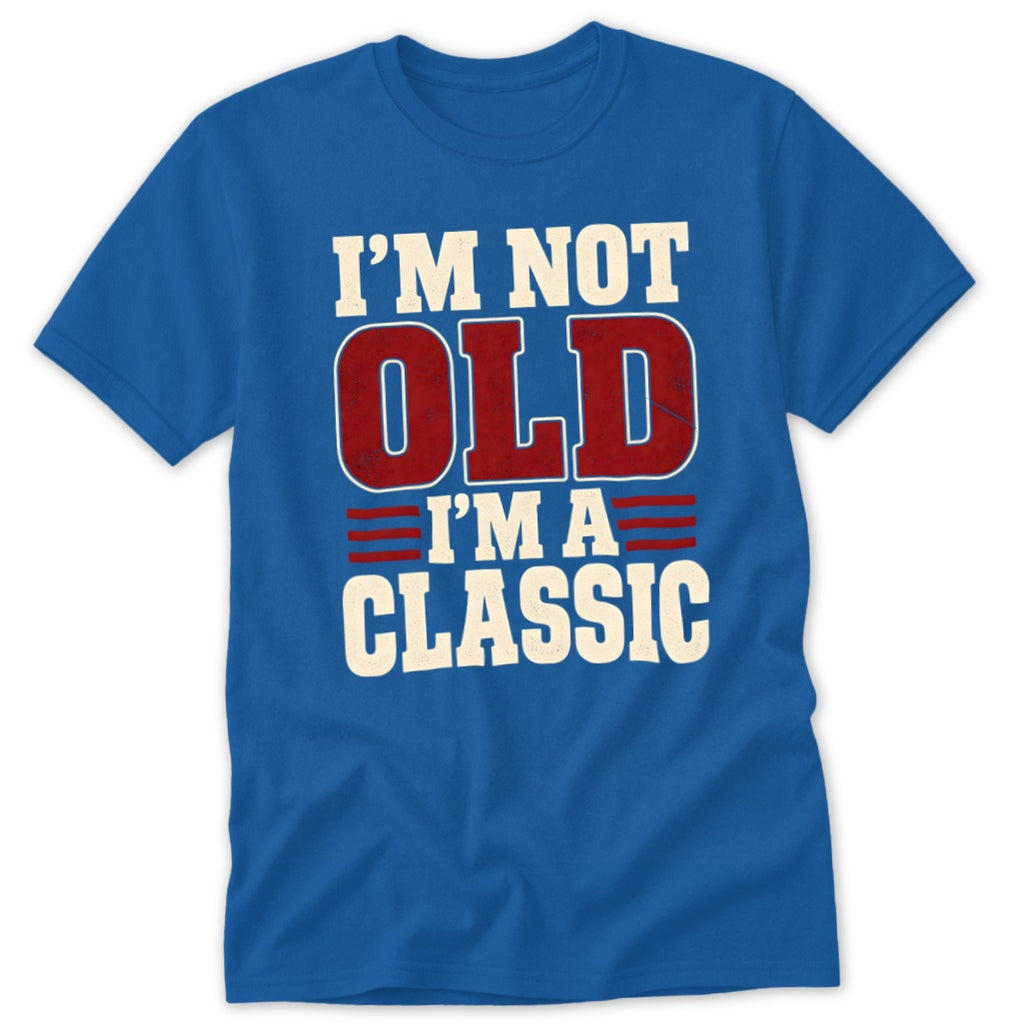 A royal blue short-sleeved t-shirt features white and red distressed text that reads I'm not old I'm a classic.