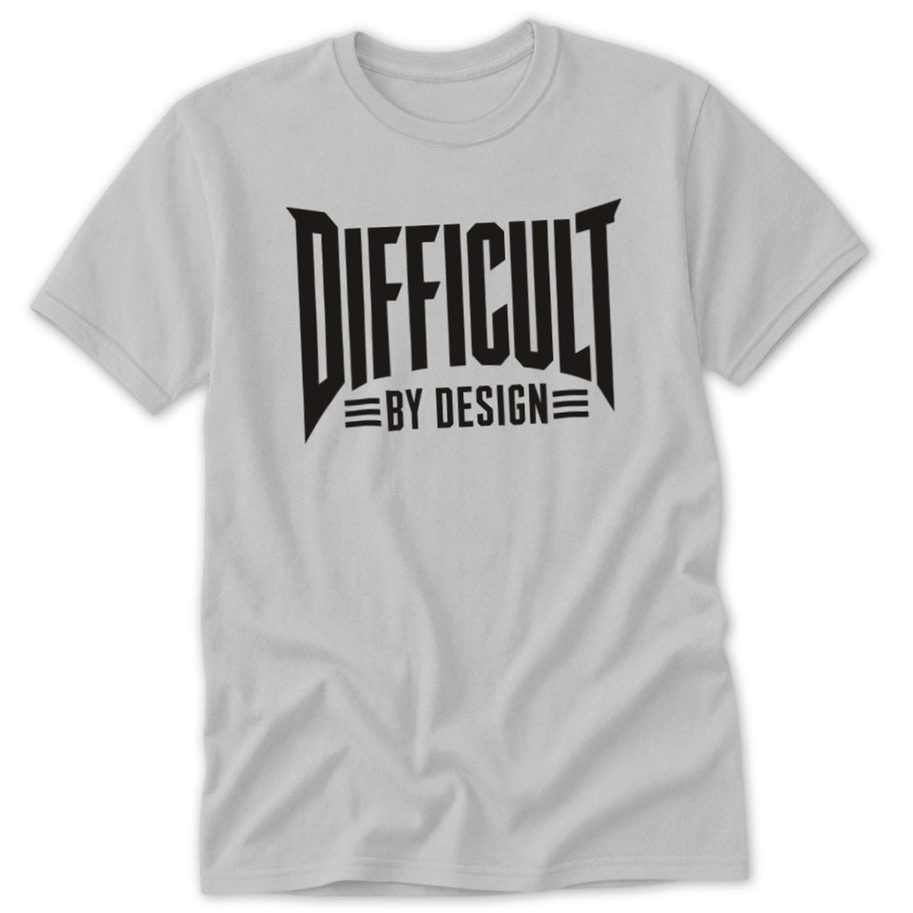 A light gray crewneck t-shirt featuring black text on the chest that reads DIFFICULT BY DESIGN.
