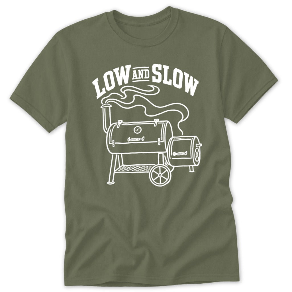 Green t-shirt with "LOW AND SLOW" text and a smoking barbecue grill graphic.
