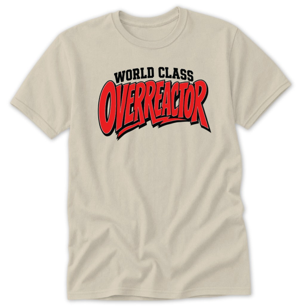 A neutral-toned t-shirt featuring the black and red text WORLD CLASS OVERREACTOR on the chest.