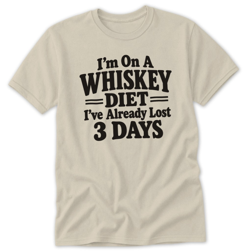 A beige t-shirt featuring the black text, I am on a whiskey diet, I've already lost 3 days.