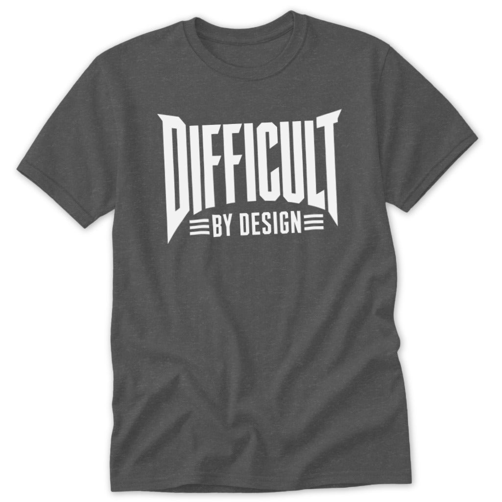 A dark gray short-sleeved t-shirt featuring the white text "DIFFICULT BY DESIGN" on the chest.