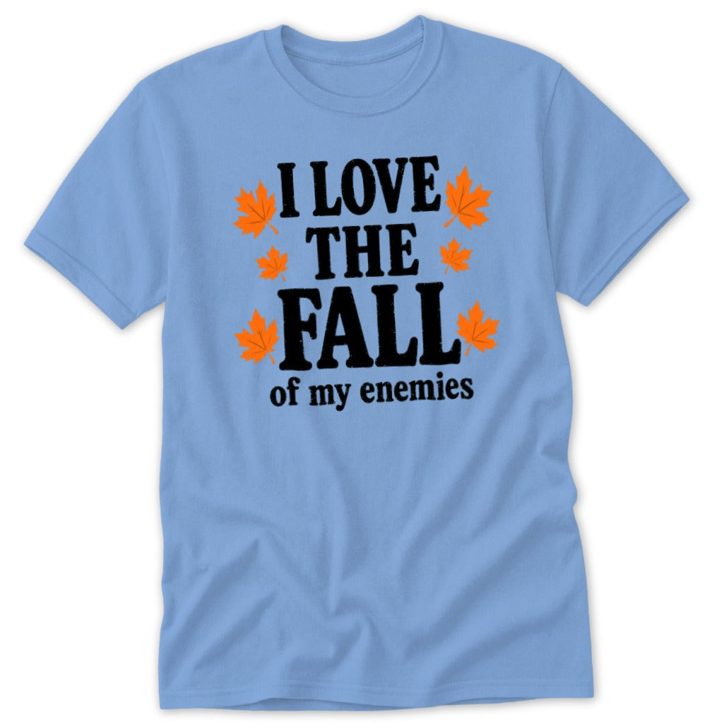 Light blue t-shirt with black text "I LOVE THE FALL of my enemies" and orange leaves.