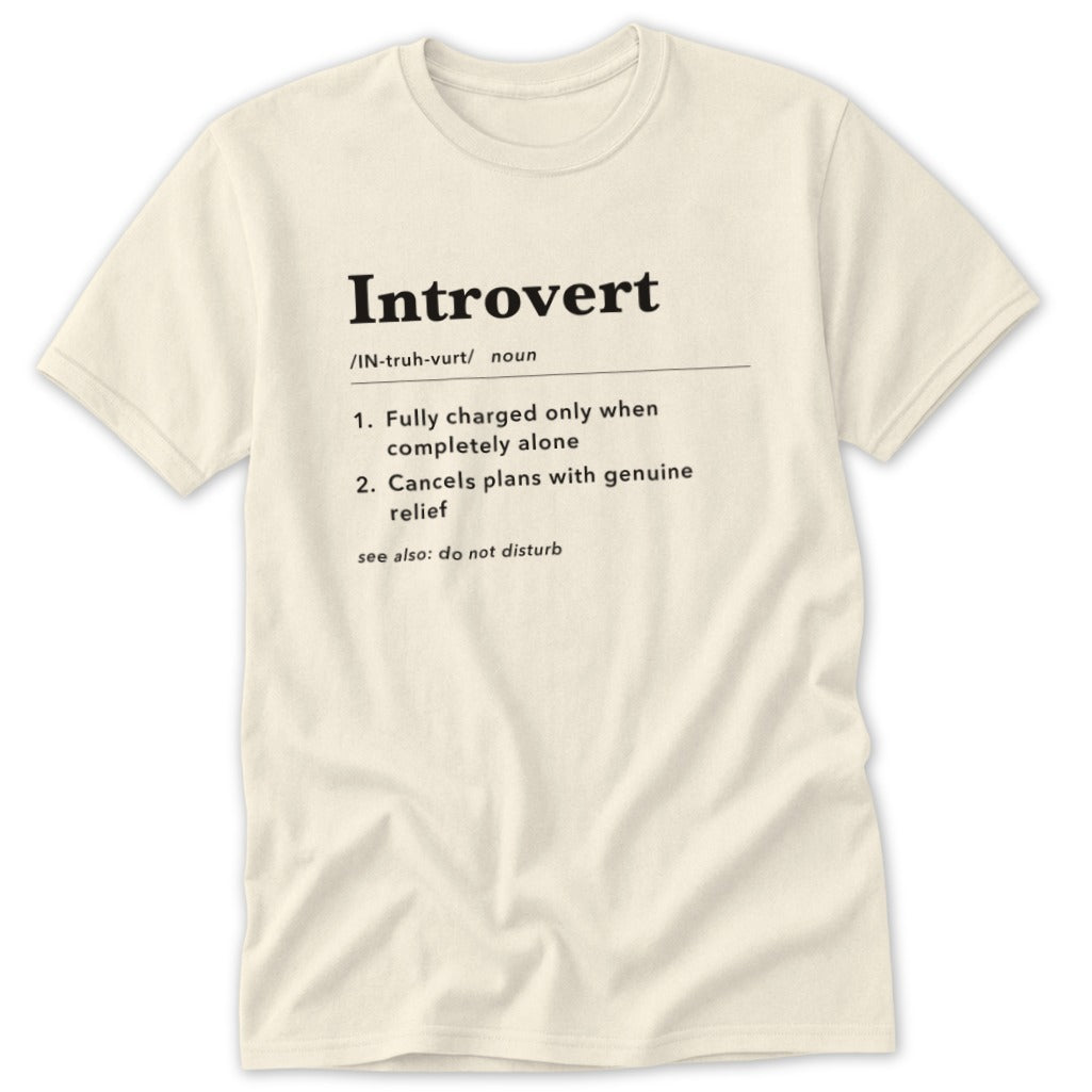 Cream t-shirt with "Introvert" definition: fully charged alone, cancels plans with relief.