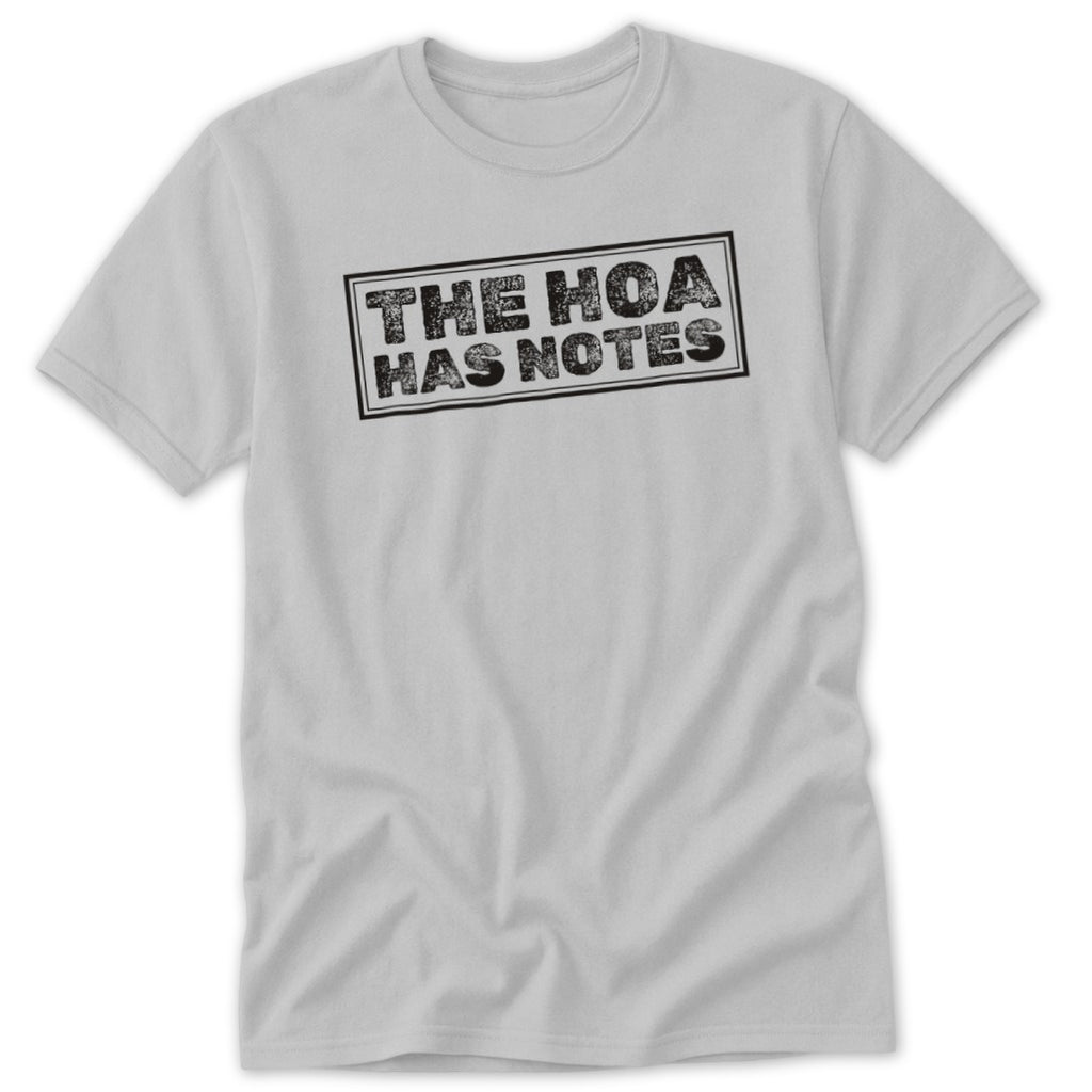 Light gray t-shirt with black text reading "THE HOA HAS NOTES" inside a rectangle.