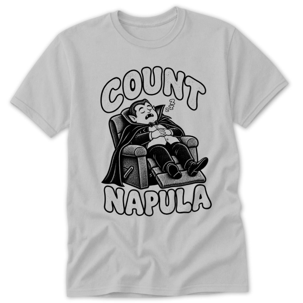 A light gray t-shirt featuring a cartoon Dracula sleeping in a recliner with text reading Count Napula.