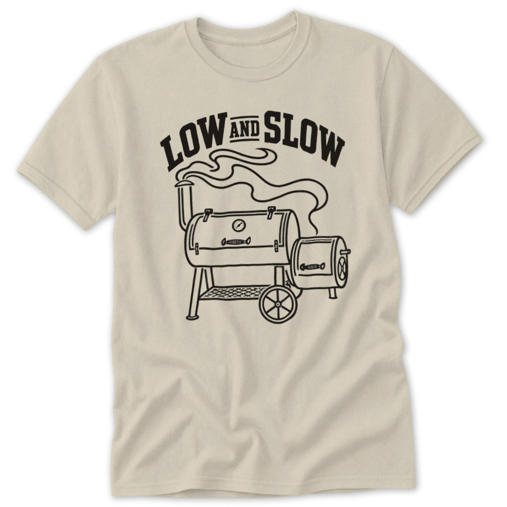 Beige t-shirt with a black line drawing of a smoker and "LOW AND SLOW" text.