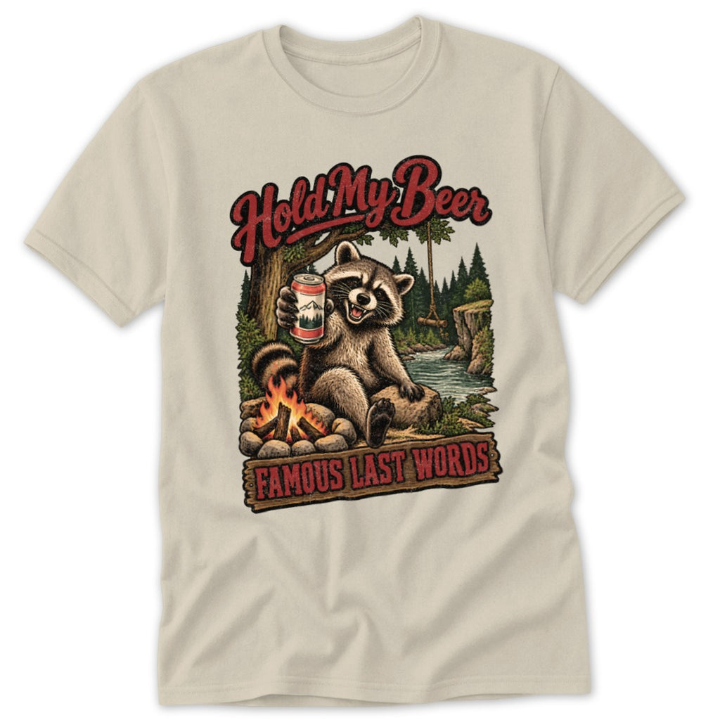 Raccoon holding a beer can by a campfire with text "Hold My Beer Famous Last Words."