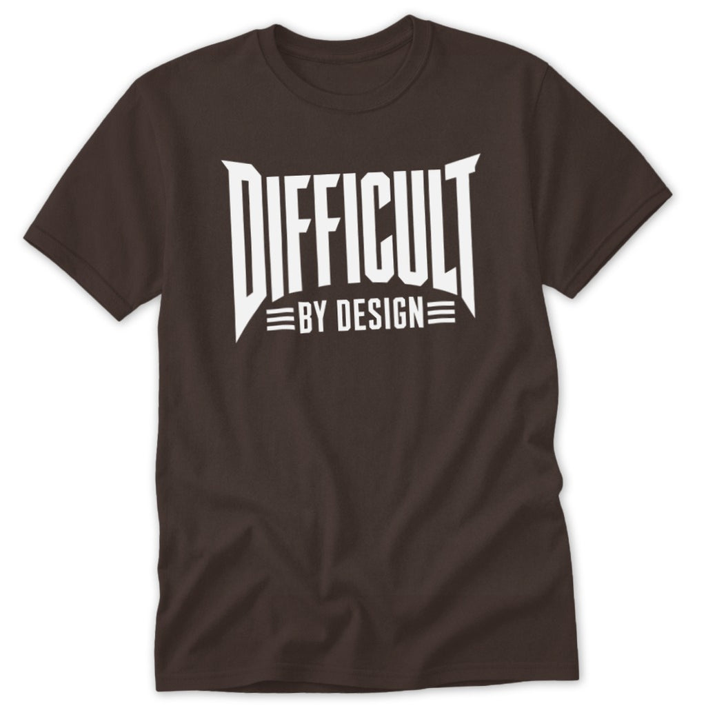 A dark brown t-shirt featuring the white text Difficult By Design on the chest.