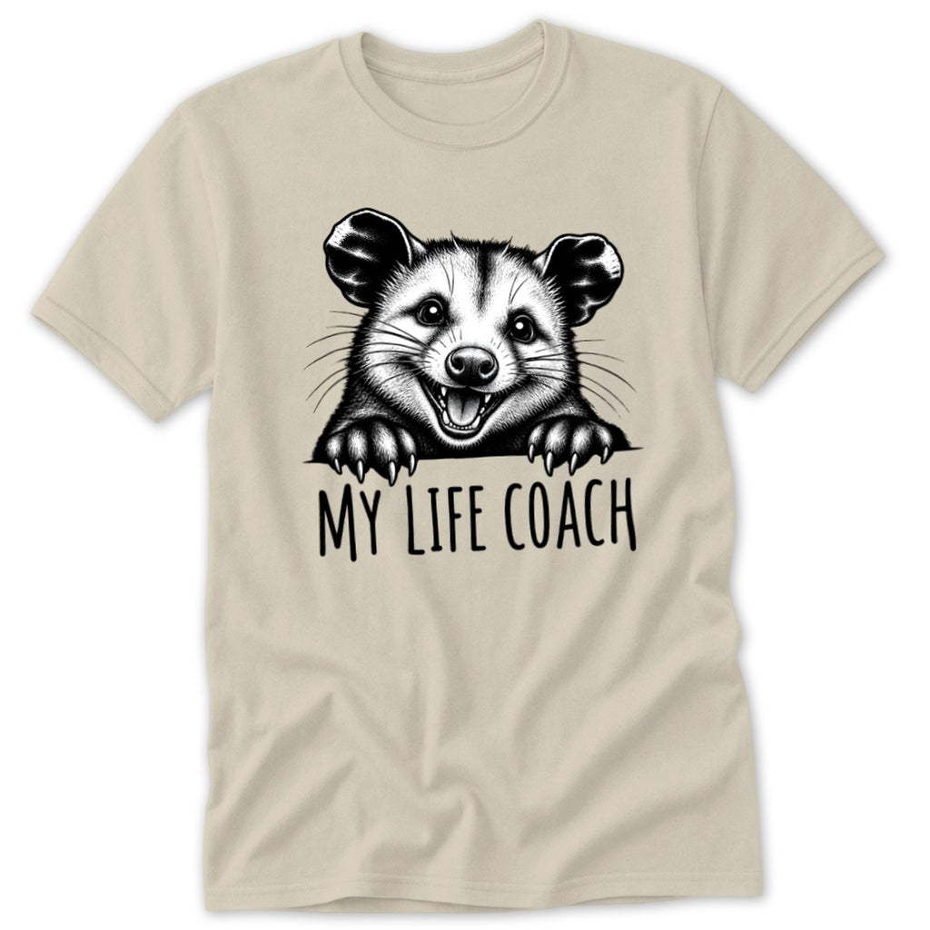 T-shirt graphic with a happy opossum and the text "MY LIFE COACH".