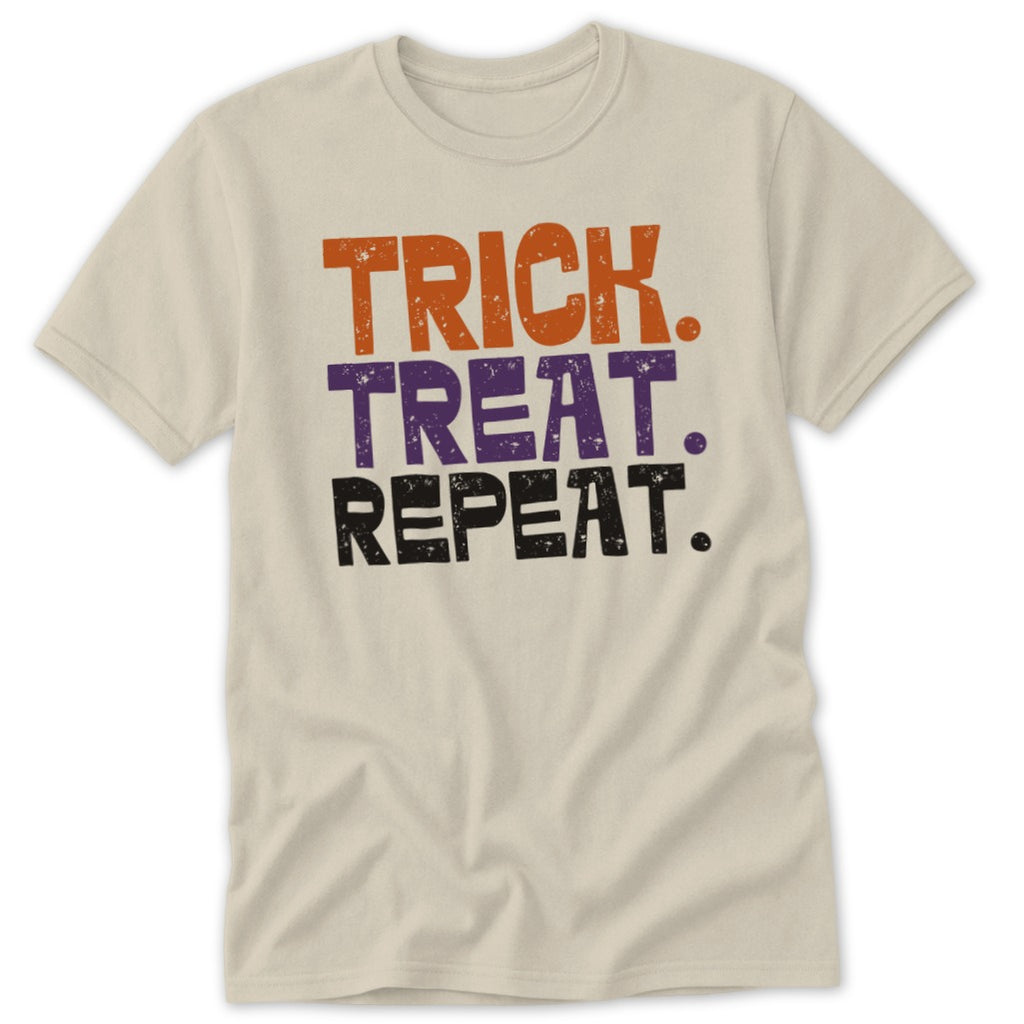 Cream t-shirt with "Trick. Treat. Repeat." text in orange, purple, and black.