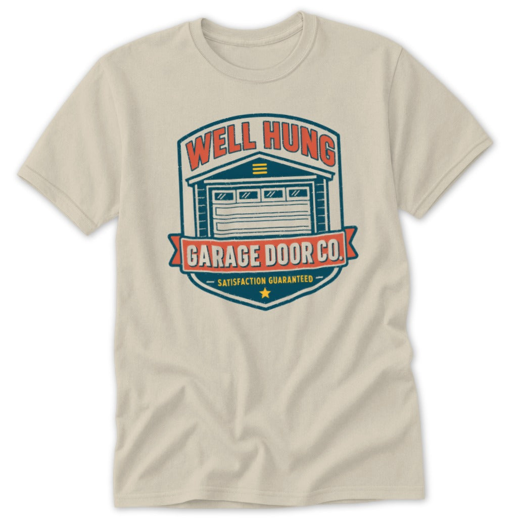 Well Hung Garage Door Co. satisfaction guaranteed logo on a light cream t-shirt.