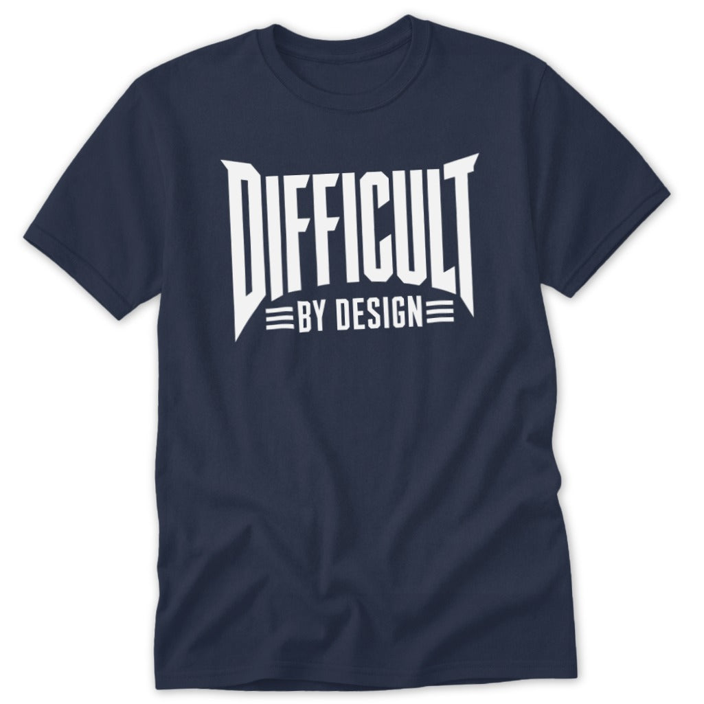 A navy blue crewneck t-shirt featuring bold white text reading Difficult By Design on the chest.