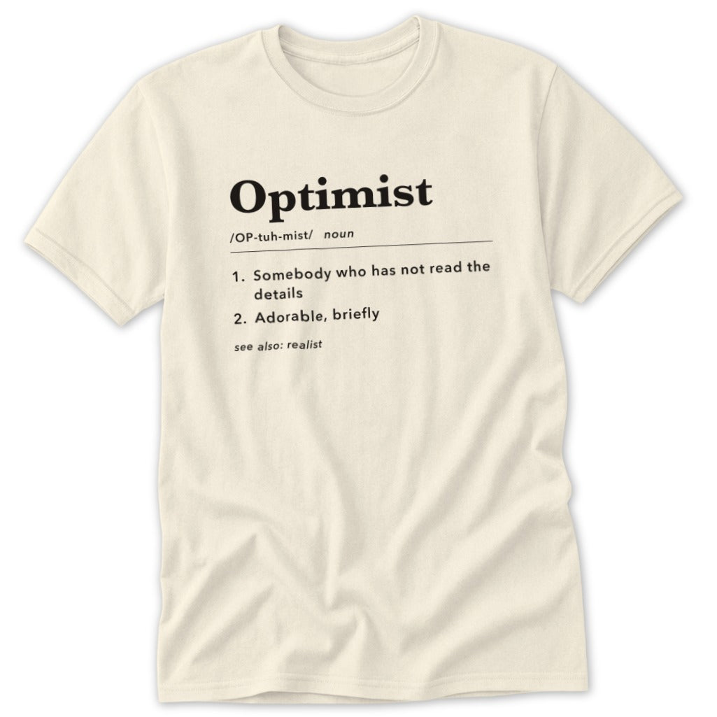 Cream t-shirt with "Optimist" definition: someone who has not read the details, adorable, briefly.