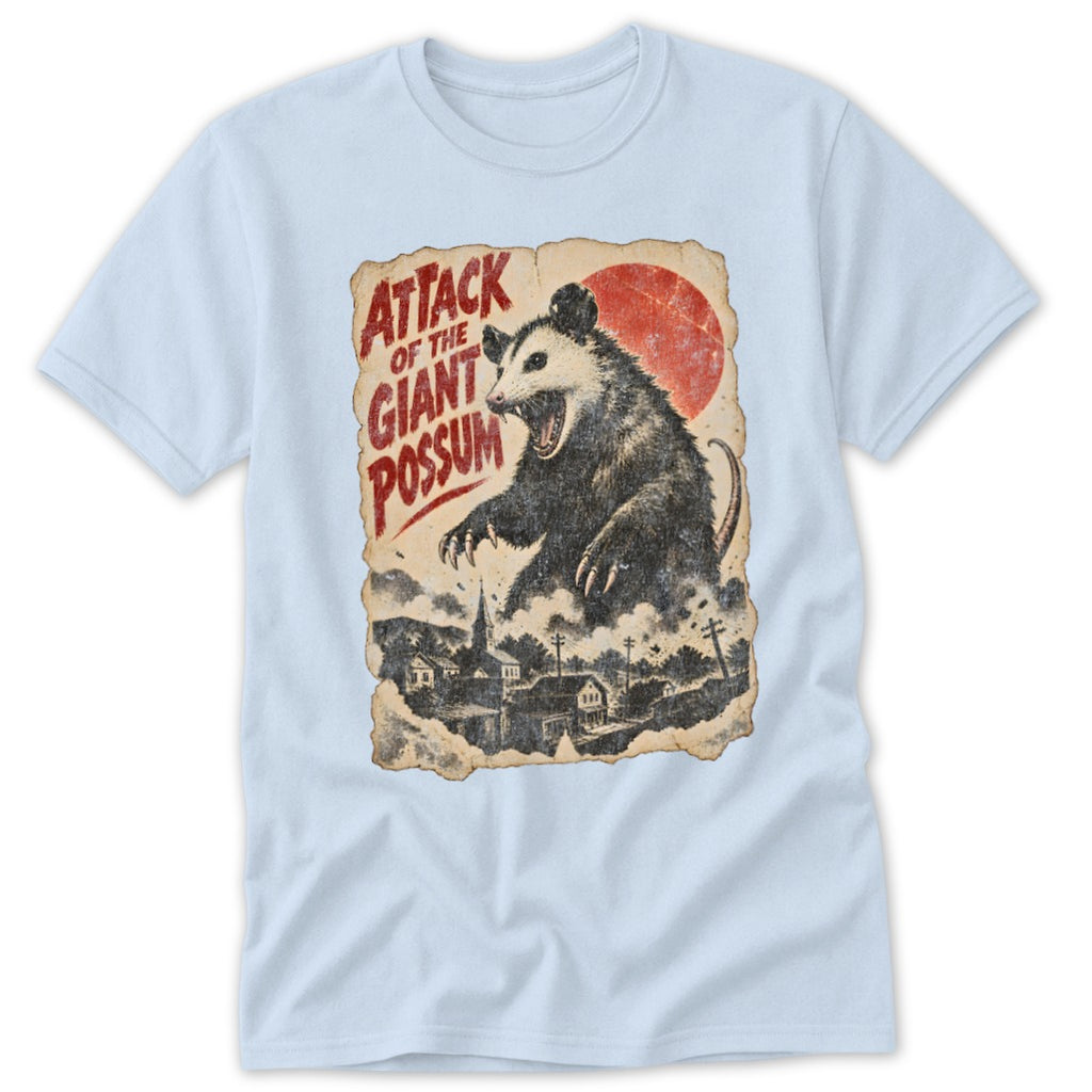 T-shirt graphic: "Attack of the Giant Possum" with a possum over a town.