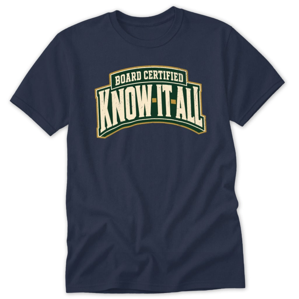 Navy blue short-sleeve t-shirt featuring the distressed text "BOARD CERTIFIED KNOW-IT-ALL" in green, white, and gold.