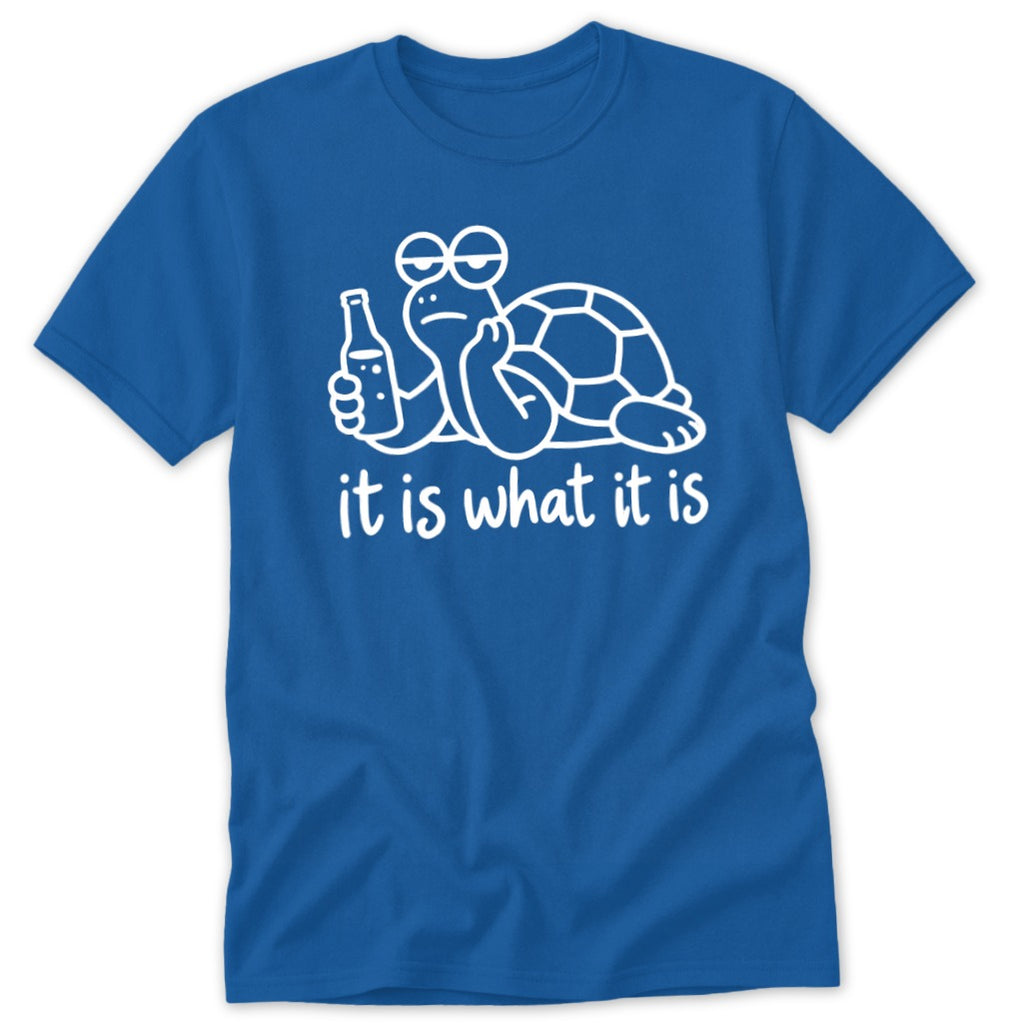 Blue t-shirt featuring a white graphic of a turtle holding a bottle with the text it is what it is
