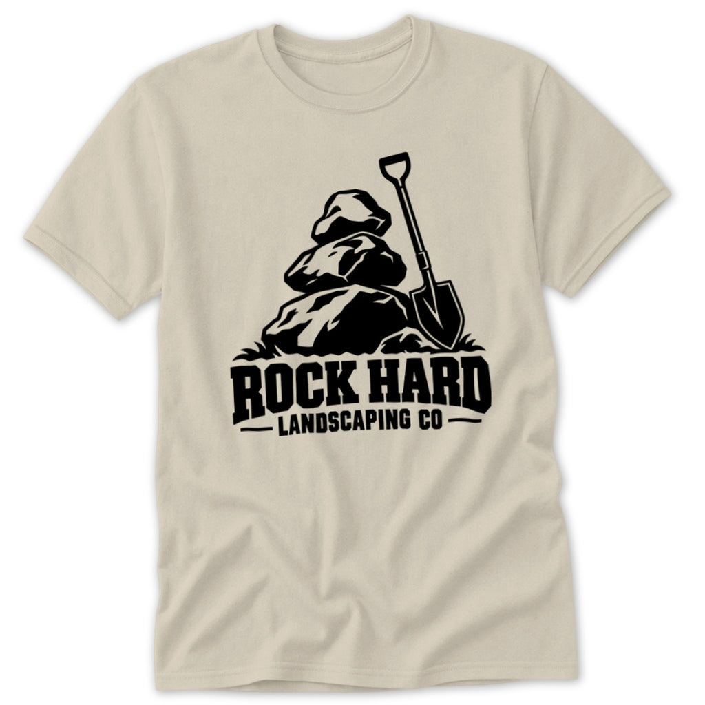 Black graphic of rocks and shovel with "Rock Hard Landscaping Co." text on a tan t-shirt.