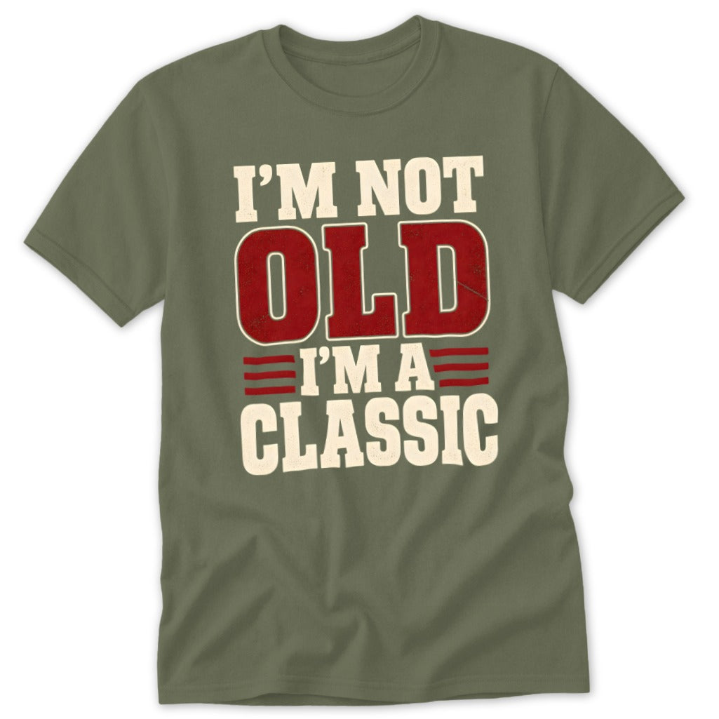 An olive green short-sleeve t-shirt with the white and red text "I'm Not Old I'm a Classic" printed on the chest.