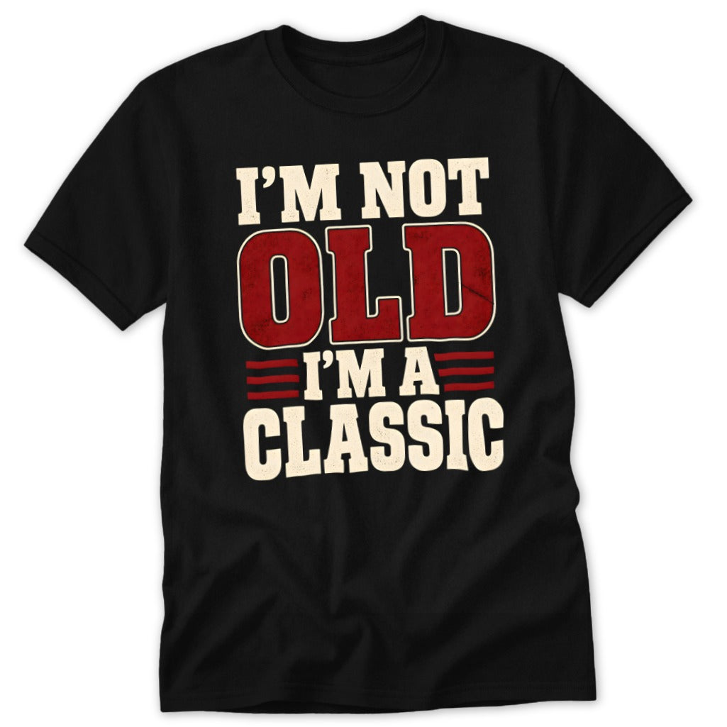 A black t-shirt printed with the text I'M NOT OLD I'M A CLASSIC in distressed white and red lettering.