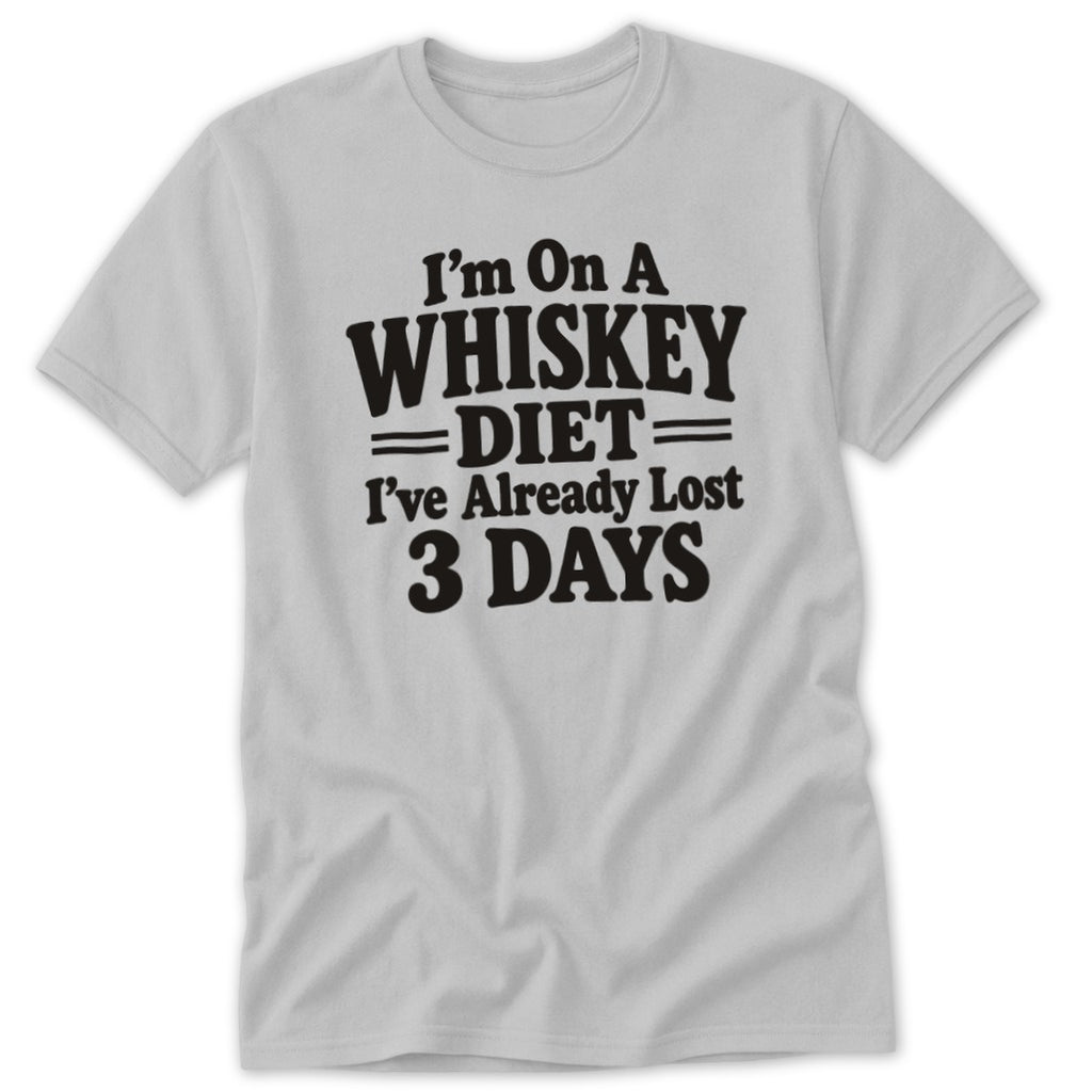 A light gray t-shirt with black text reading "I'm On A Whiskey Diet I've Already Lost 3 Days."