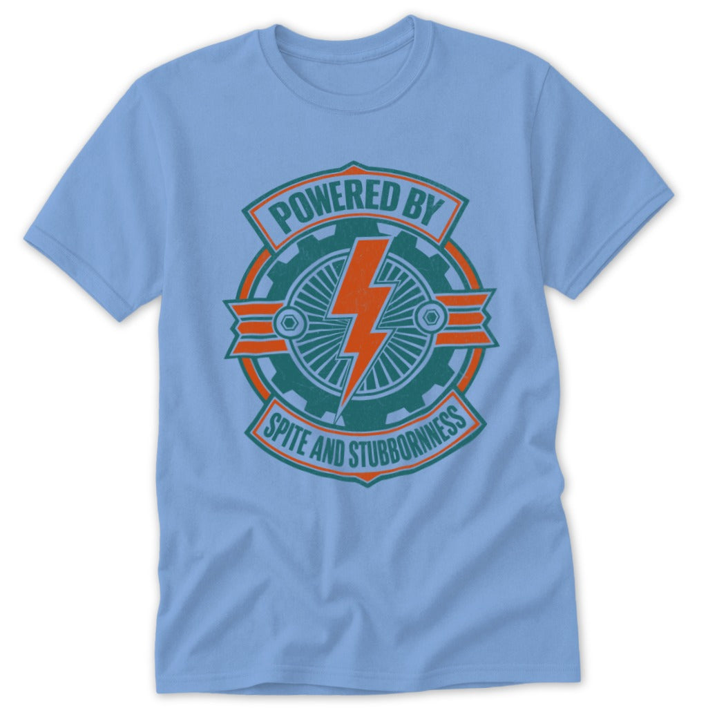 Light blue t-shirt with "Powered by Spite and Stubbornness" graphic.