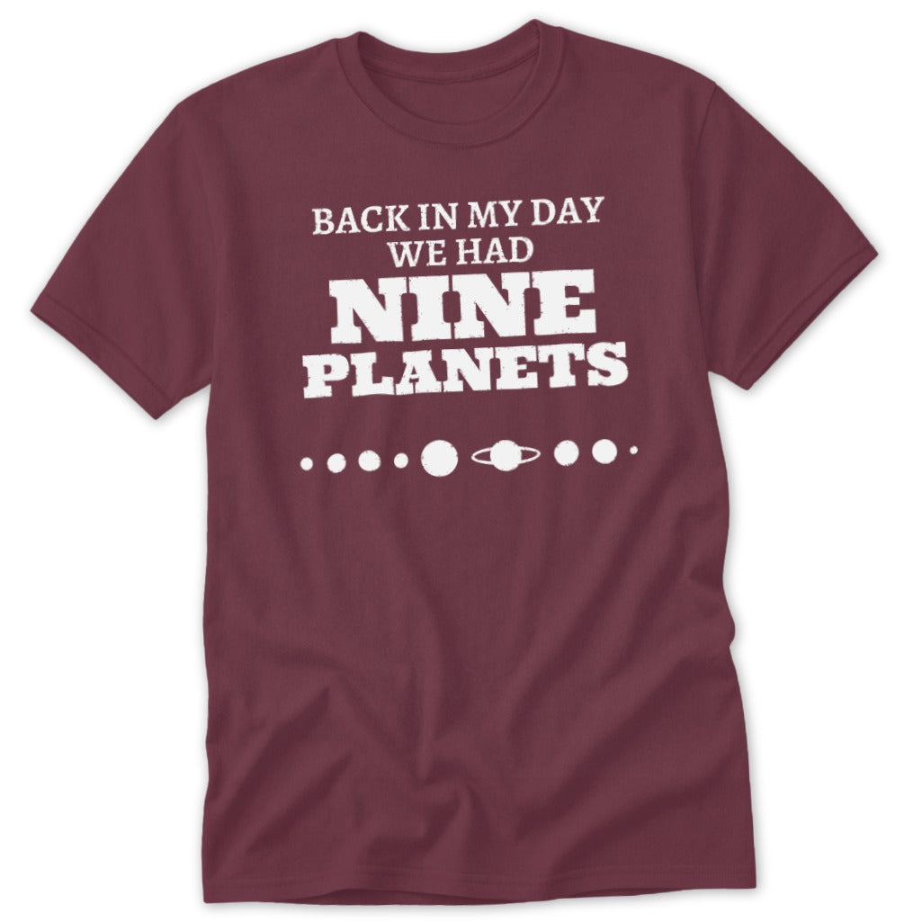 Maroon t-shirt with "Back in my day we had Nine Planets" text.