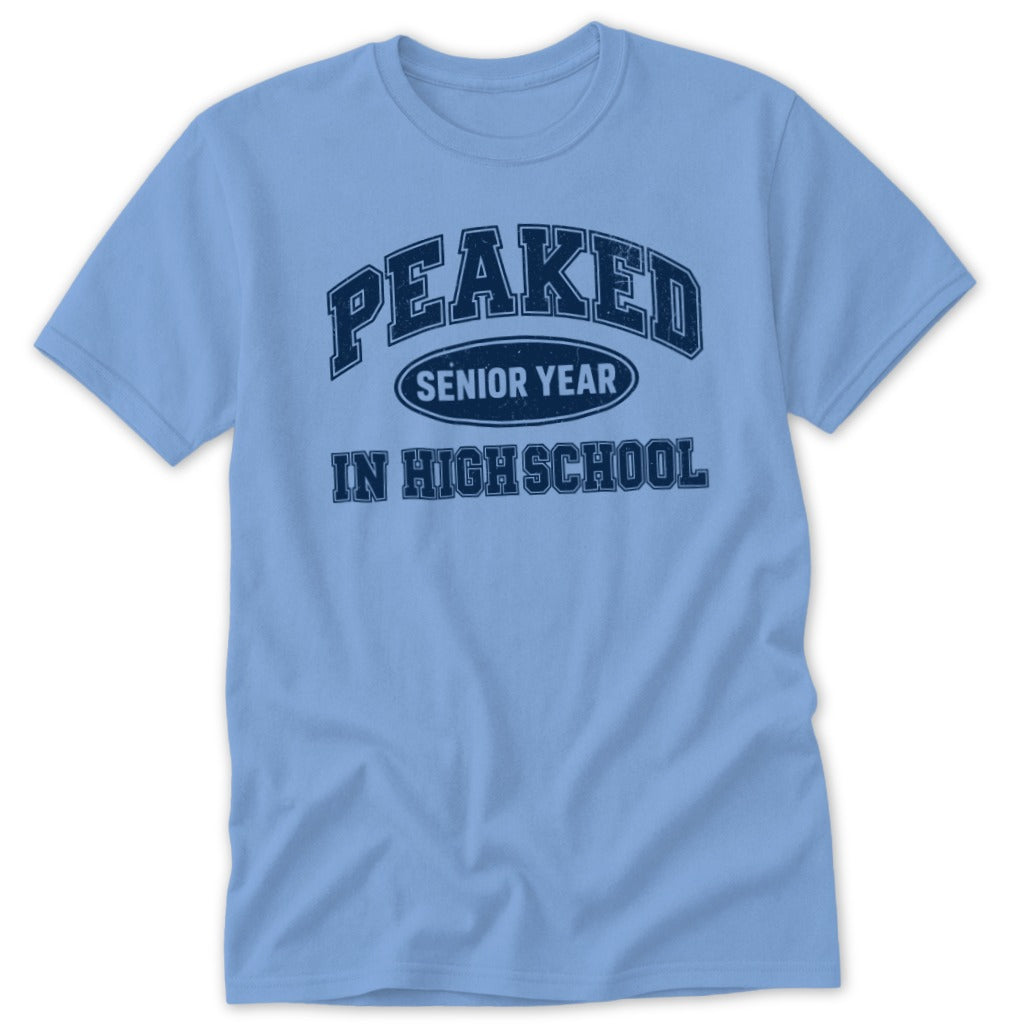 Light blue t-shirt with "PEAKED SENIOR YEAR IN HIGH SCHOOL" graphic.