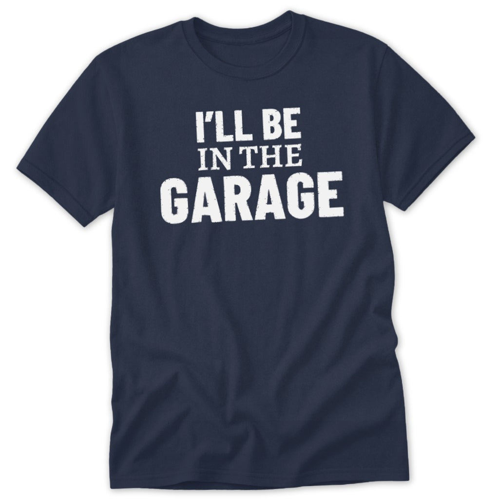 Navy t-shirt with white distressed text that reads "I'LL BE IN THE GARAGE".