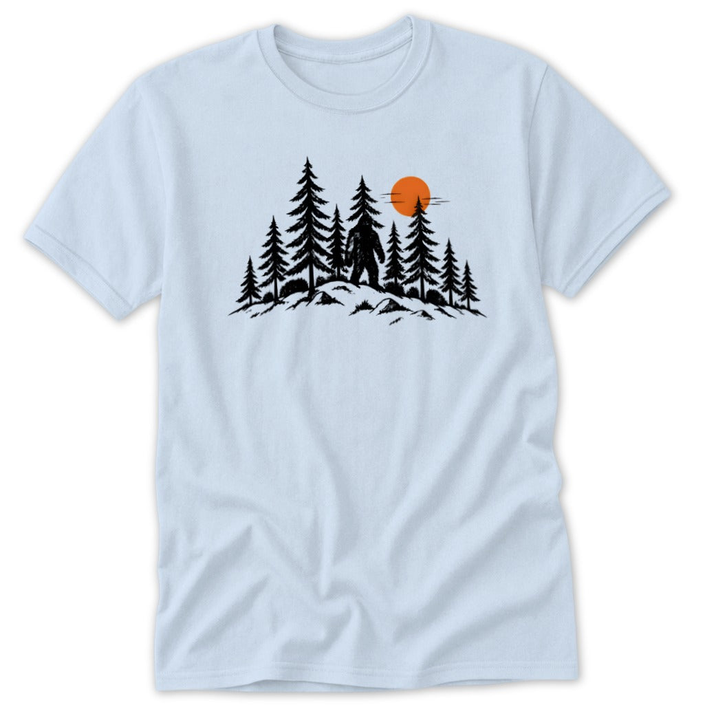Bigfoot silhouette standing in pine forest with orange sun setting.